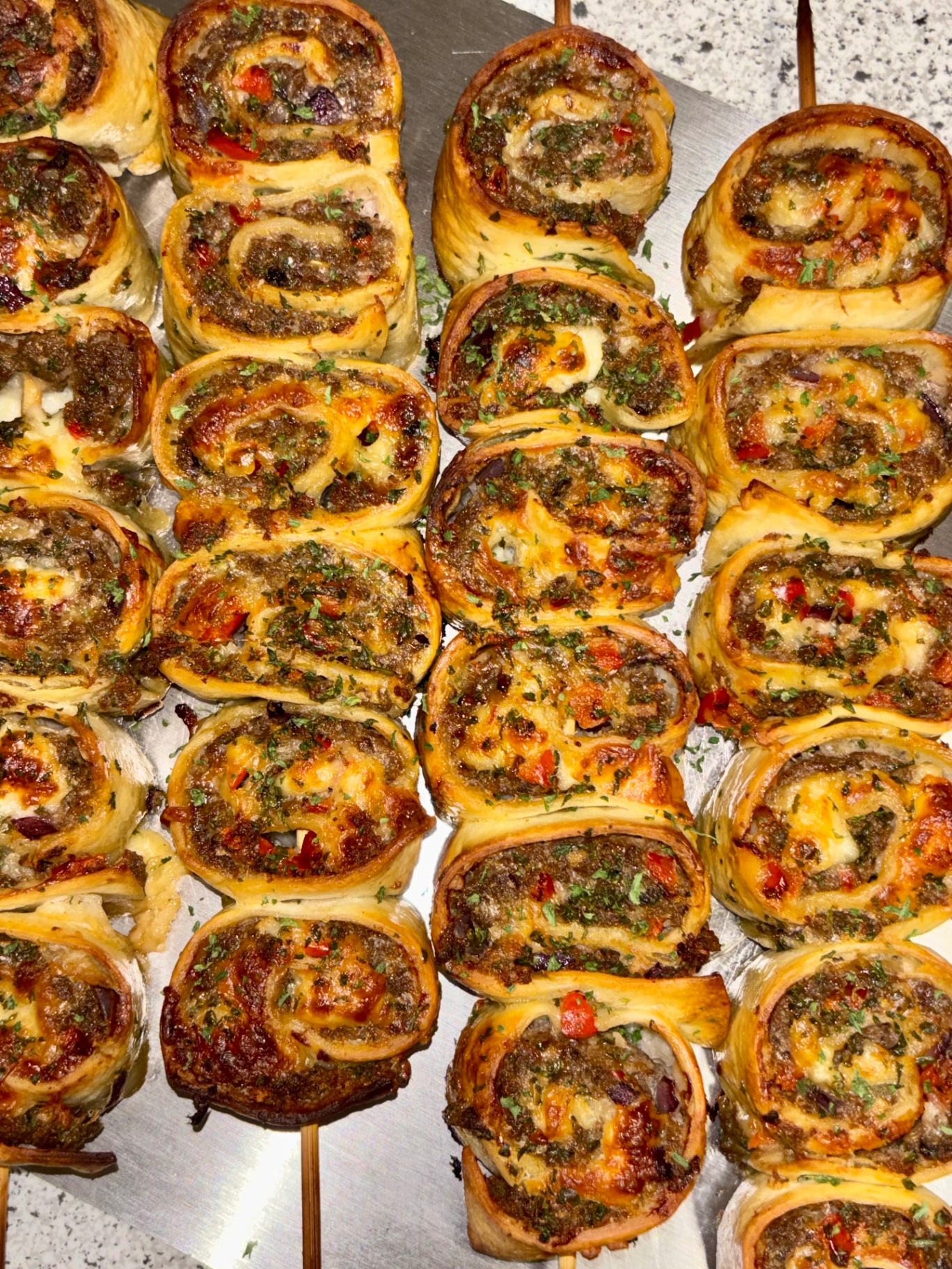 Pinwheel kebabs behind the pass