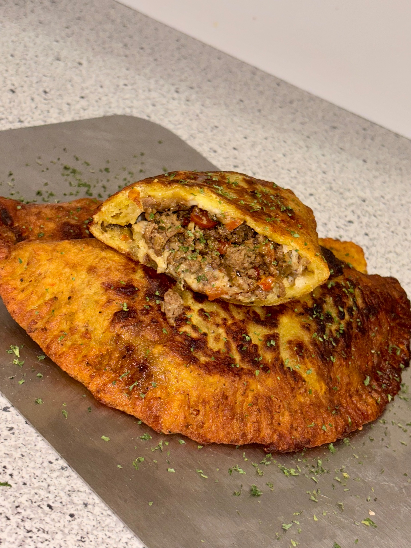 Caribbean plantain beef patty sliced open